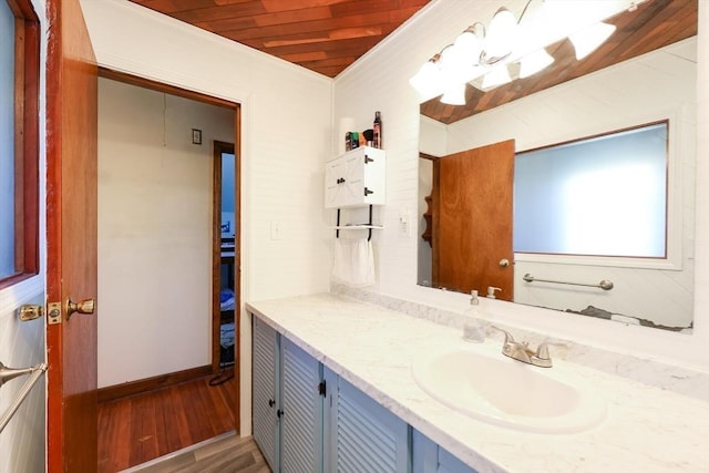 bathroom featuring wood ceiling, vanity, and wood finished floors