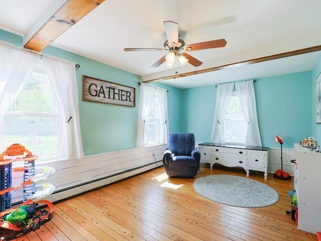 interior space featuring a ceiling fan and hardwood / wood-style floors