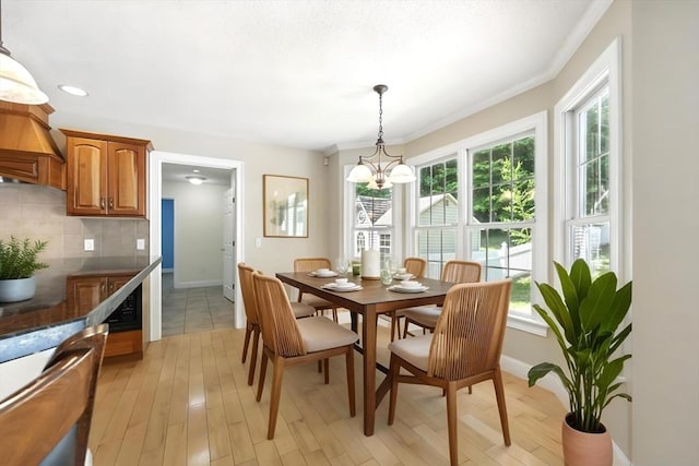 10 Tigger Ln, South Hadley, MA 01075 - dining room featuring a chandelier, plenty of natural light, light wood finished floors, ornamental molding, and recessed lighting