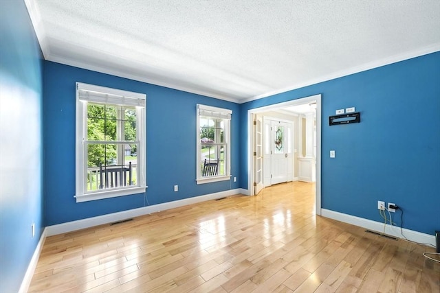 10 Tigger Ln, South Hadley, MA 01075 - spare room with a textured ceiling, ornamental molding, and wood finished floors
