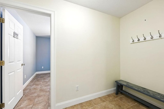 10 Tigger Ln, South Hadley, MA 01075 - hallway featuring baseboards and tile patterned flooring