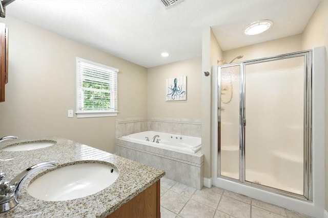 10 Tigger Ln, South Hadley, MA 01075 - bathroom featuring a stall shower, a bath, tile patterned floors, and double vanity