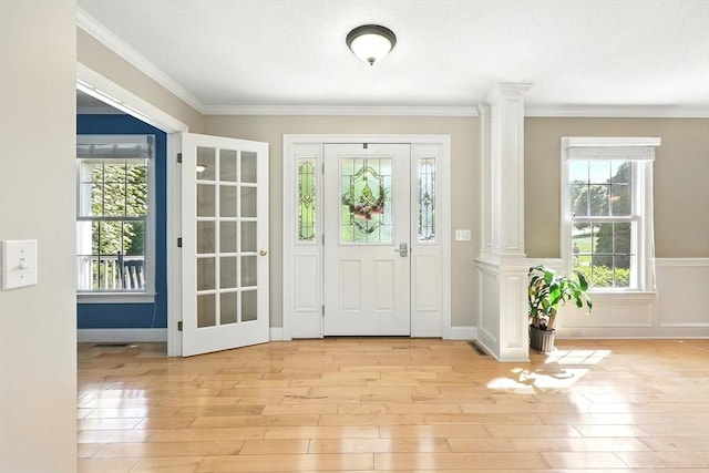 10 Tigger Ln, South Hadley, MA 01075 - entrance foyer featuring decorative columns, light wood finished floors, healthy amount of natural light, and crown molding