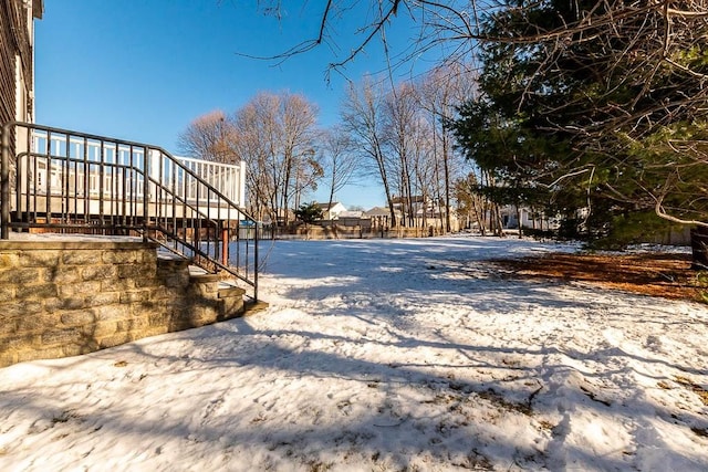 view of yard layered in snow