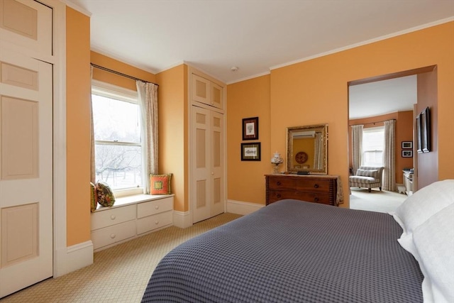 bedroom featuring baseboards, light carpet, and ornamental molding