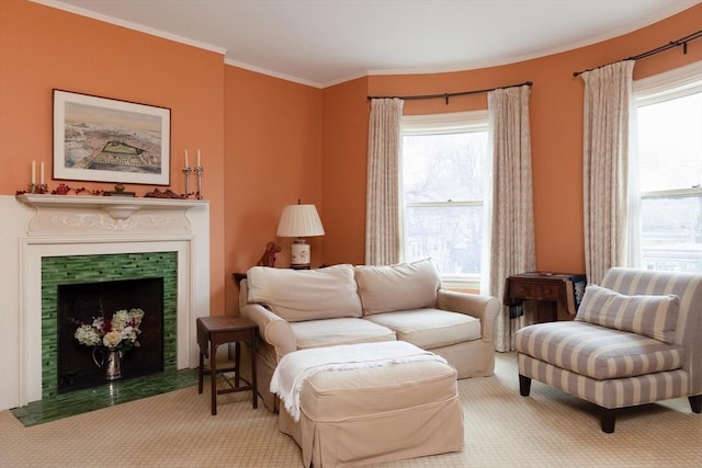 carpeted living room featuring crown molding and a fireplace