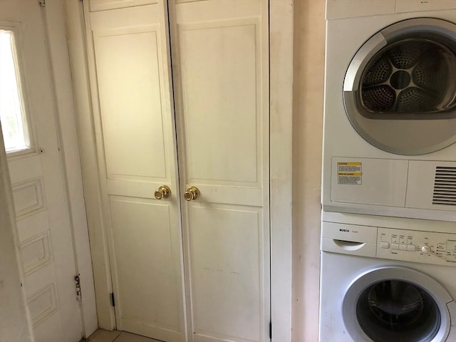 washroom with laundry area and stacked washer and dryer