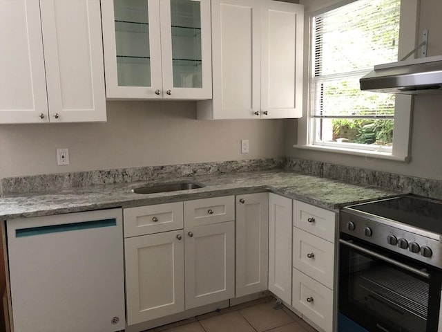 kitchen with ventilation hood, white cabinets, dishwashing machine, and range with electric stovetop