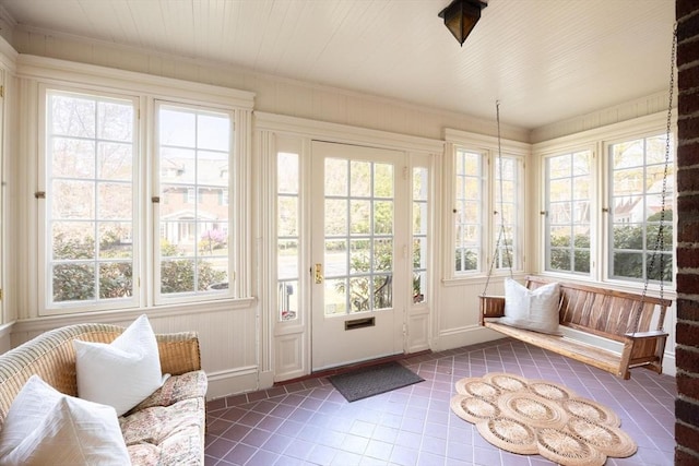 87 Crowninshield Rd, Brookline, MA 02446 - sunroom featuring tile patterned floors, plenty of natural light, and french doors
