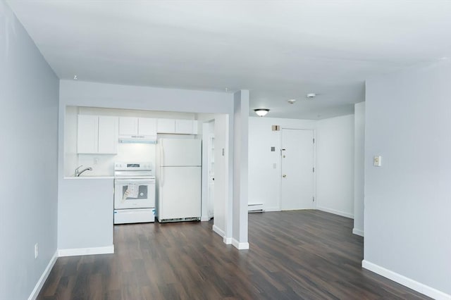 kitchen featuring white appliances, under cabinet range hood, white cabinetry, dark wood-style flooring, and a baseboard heating unit