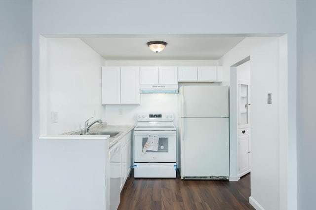kitchen featuring white appliances, under cabinet range hood, a sink, and white cabinets