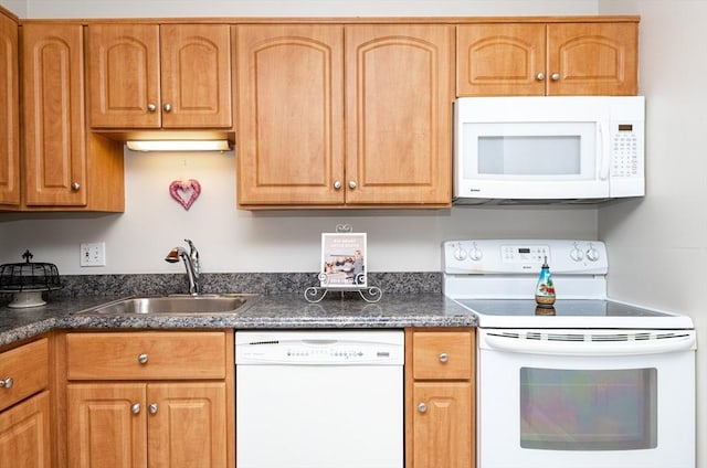 kitchen with sink and white appliances