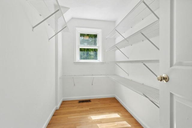 94 Old Right Rd, Ipswich, MA 01938 - spacious closet featuring light wood-style floors and vaulted ceiling