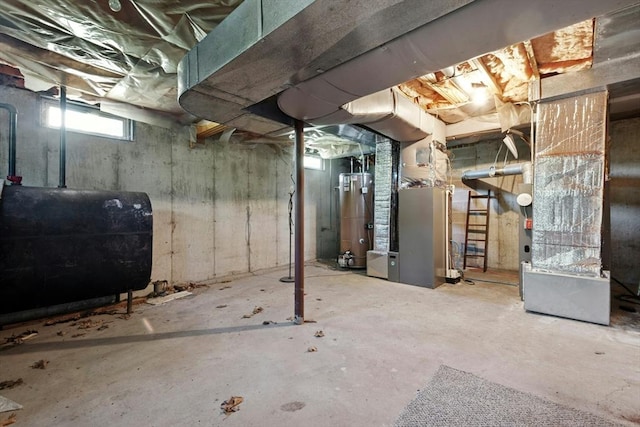 94 Old Right Rd, Ipswich, MA 01938 - basement with oil tank, gas water heater, and heating unit