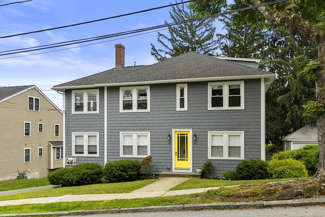 16 Field Rd Unit 16, Arlington, MA 02476 - colonial-style house with a chimney, a shingled roof, and a front yard