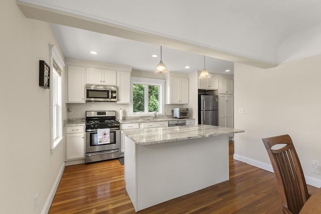 16 Field Rd Unit 16, Arlington, MA 02476 - kitchen featuring appliances with stainless steel finishes, dark wood-style flooring, white cabinetry, a center island, and recessed lighting