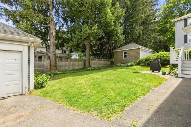 16 Field Rd Unit 16, Arlington, MA 02476 - view of yard featuring an outbuilding and a garage