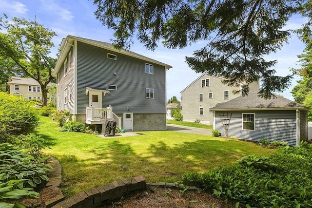 16 Field Rd Unit 16, Arlington, MA 02476 - rear view of house with a lawn
