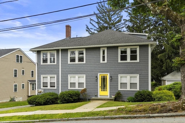 16 Field Rd Unit 16, Arlington, MA 02476 - colonial house featuring a chimney, a shingled roof, and a front lawn