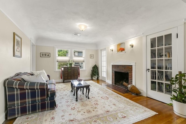 16 Field Rd Unit 16, Arlington, MA 02476 - living room with healthy amount of natural light, wood finished floors, and a fireplace