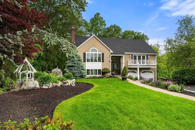 4 Blacksmith Way, Saugus, MA 01906 - view of front of home with a chimney, an attached garage, a front yard, and roof with shingles