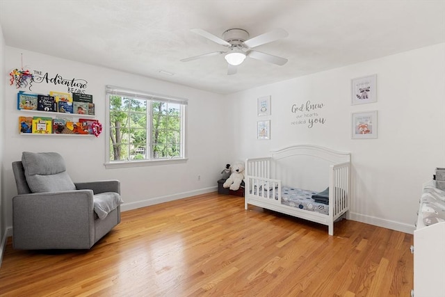 4 Blacksmith Way, Saugus, MA 01906 - bedroom featuring a nursery area, light wood-type flooring, baseboards, and ceiling fan