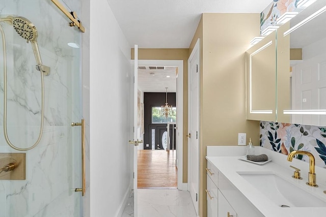 4 Blacksmith Way, Saugus, MA 01906 - bathroom with marble finish flooring, a marble finish shower, vanity, baseboards, and a chandelier