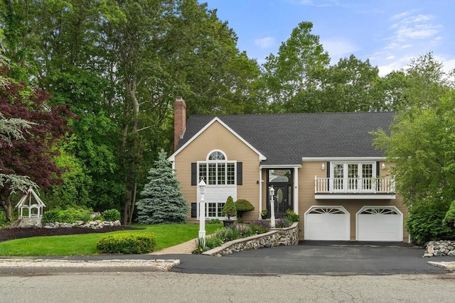 4 Blacksmith Way, Saugus, MA 01906 - view of front of property with a balcony, an attached garage, a chimney, driveway, and roof with shingles