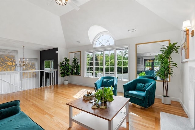 4 Blacksmith Way, Saugus, MA 01906 - living room with a chandelier, wood finished floors, high vaulted ceiling, baseboards, and ceiling fan