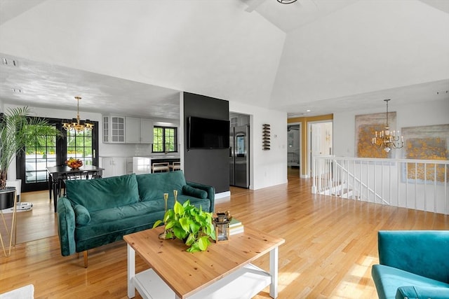 4 Blacksmith Way, Saugus, MA 01906 - living area with a chandelier, light wood-type flooring, and high vaulted ceiling
