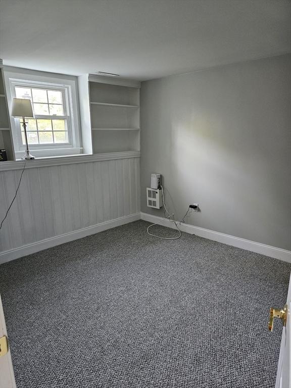 spare room with carpet floors and baseboards