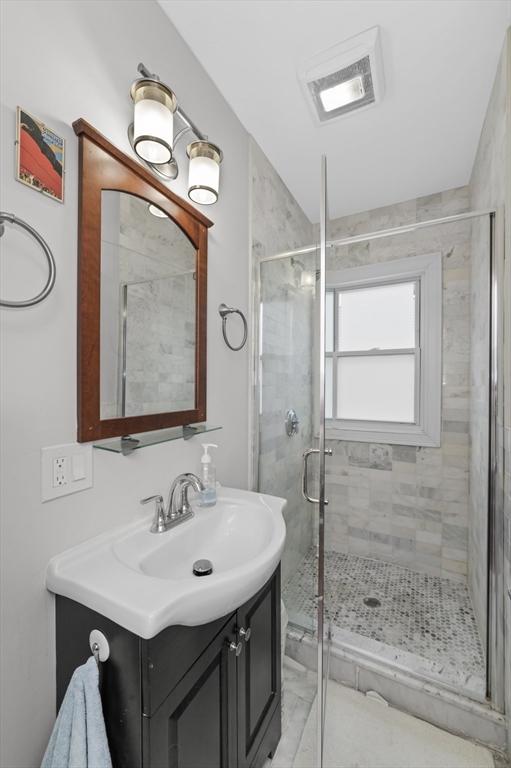 200 Elliot St Unit 1, Newton, MA 02464 - bathroom featuring vanity and a stall shower