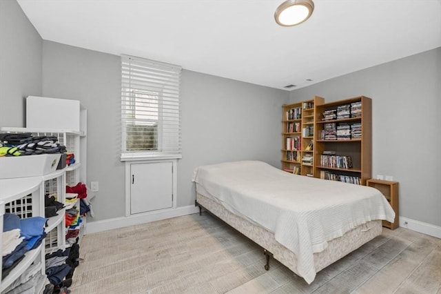 200 Elliot St Unit 1, Newton, MA 02464 - bedroom with baseboards and wood finished floors