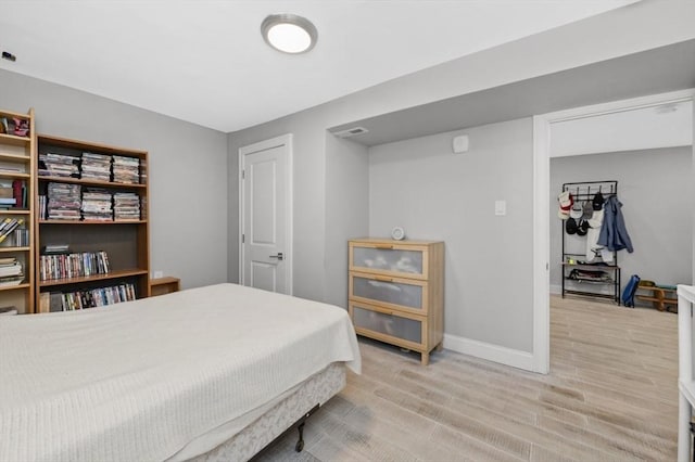 200 Elliot St Unit 1, Newton, MA 02464 - bedroom with light wood-type flooring and baseboards