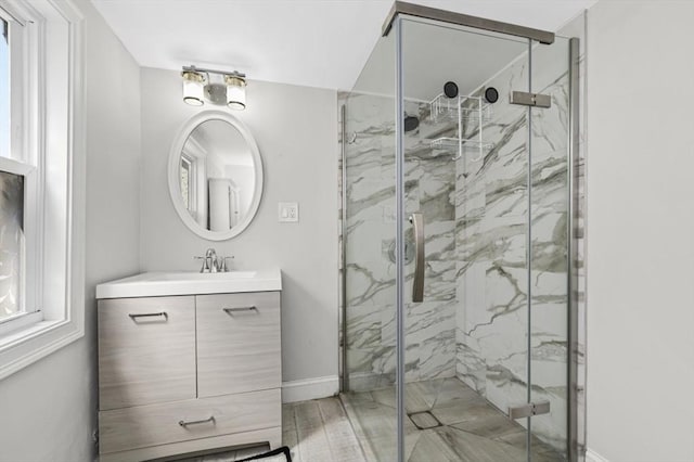 200 Elliot St Unit 1, Newton, MA 02464 - full bath featuring vanity, a marble finish shower, and baseboards