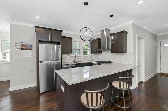 200 Elliot St Unit 1, Newton, MA 02464 - kitchen featuring appliances with stainless steel finishes, wall chimney range hood, a peninsula, dark brown cabinets, and dark wood finished floors