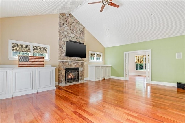 138 Saddleworth Way, Middleboro, MA 02346 - unfurnished living room with ceiling fan, high vaulted ceiling, light wood finished floors, a fireplace, and baseboards