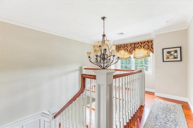 138 Saddleworth Way, Middleboro, MA 02346 - hallway with a chandelier, an upstairs landing, wood finished floors, and ornamental molding