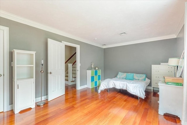 138 Saddleworth Way, Middleboro, MA 02346 - bedroom with light wood-type flooring, ornamental molding, and baseboards