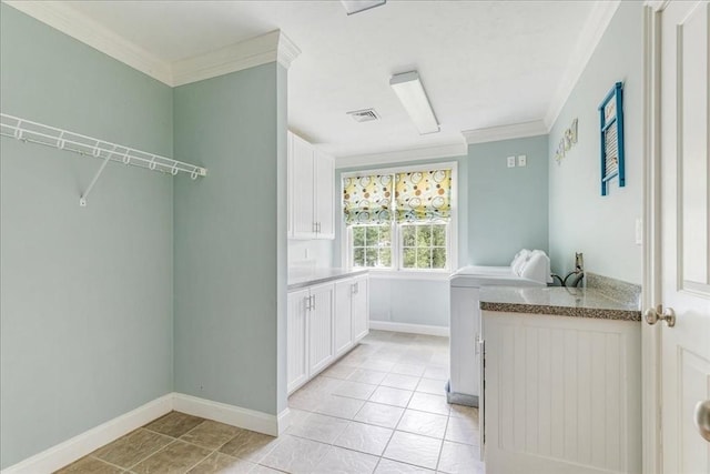 138 Saddleworth Way, Middleboro, MA 02346 - laundry area featuring ornamental molding, light tile patterned flooring, baseboards, and cabinet space