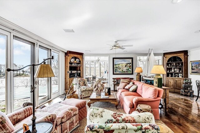 141 Daniels Island Rd, Mashpee, MA 02649 - living room with crown molding, wood finished floors, ceiling fan, and built in shelves