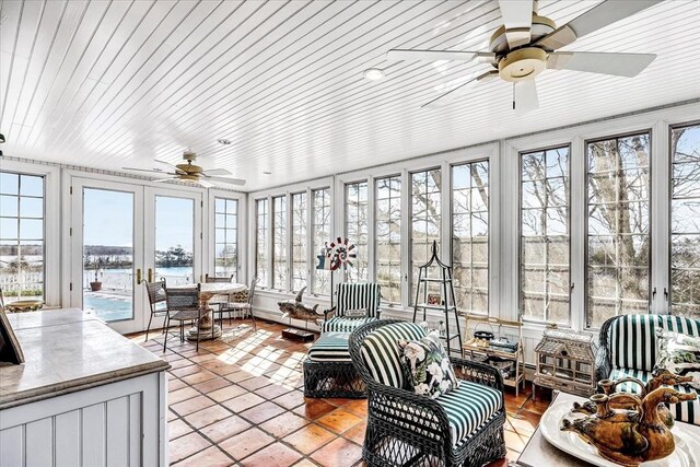 141 Daniels Island Rd, Mashpee, MA 02649 - sunroom / solarium featuring french doors, a water view, and tile patterned floors