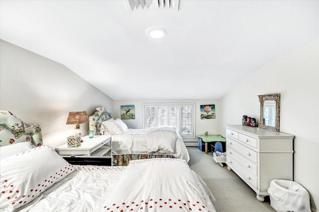 141 Daniels Island Rd, Mashpee, MA 02649 - bedroom with vaulted ceiling, multiple windows, baseboard heating, and light carpet
