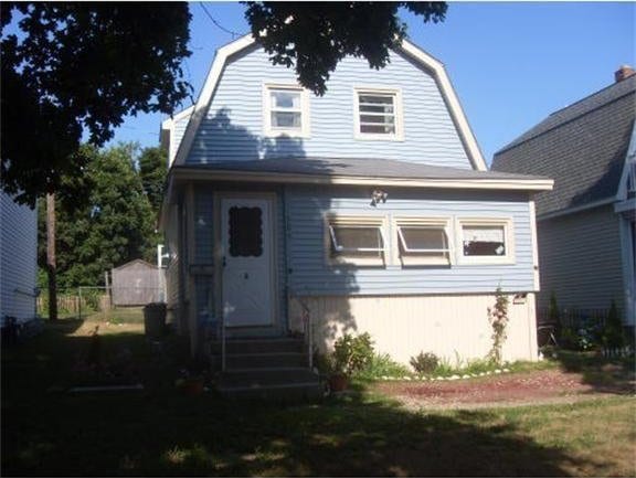 view of front of house with entry steps and a gambrel roof