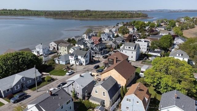 birds eye view of property with a water view and a residential view