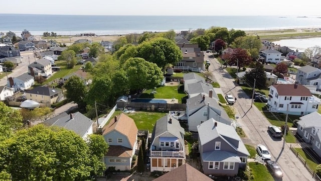 birds eye view of property with a residential view and a water view