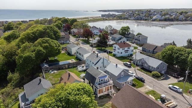 drone / aerial view with a water view and a residential view