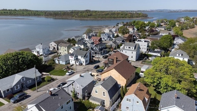 aerial view with a water view and a residential view