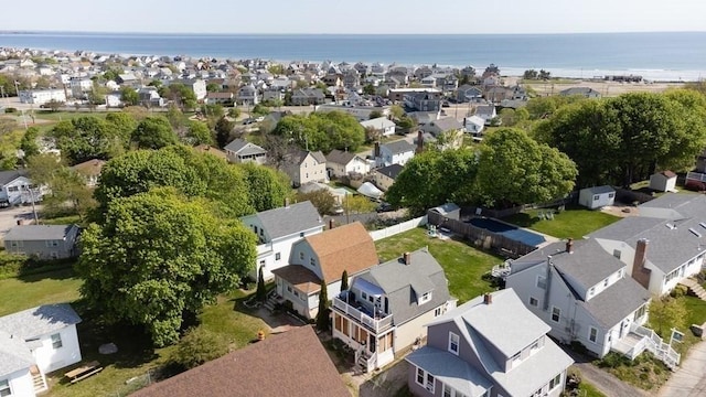 bird's eye view with a residential view and a water view