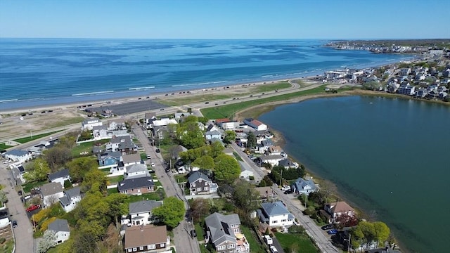 aerial view with a water view and a view of the beach